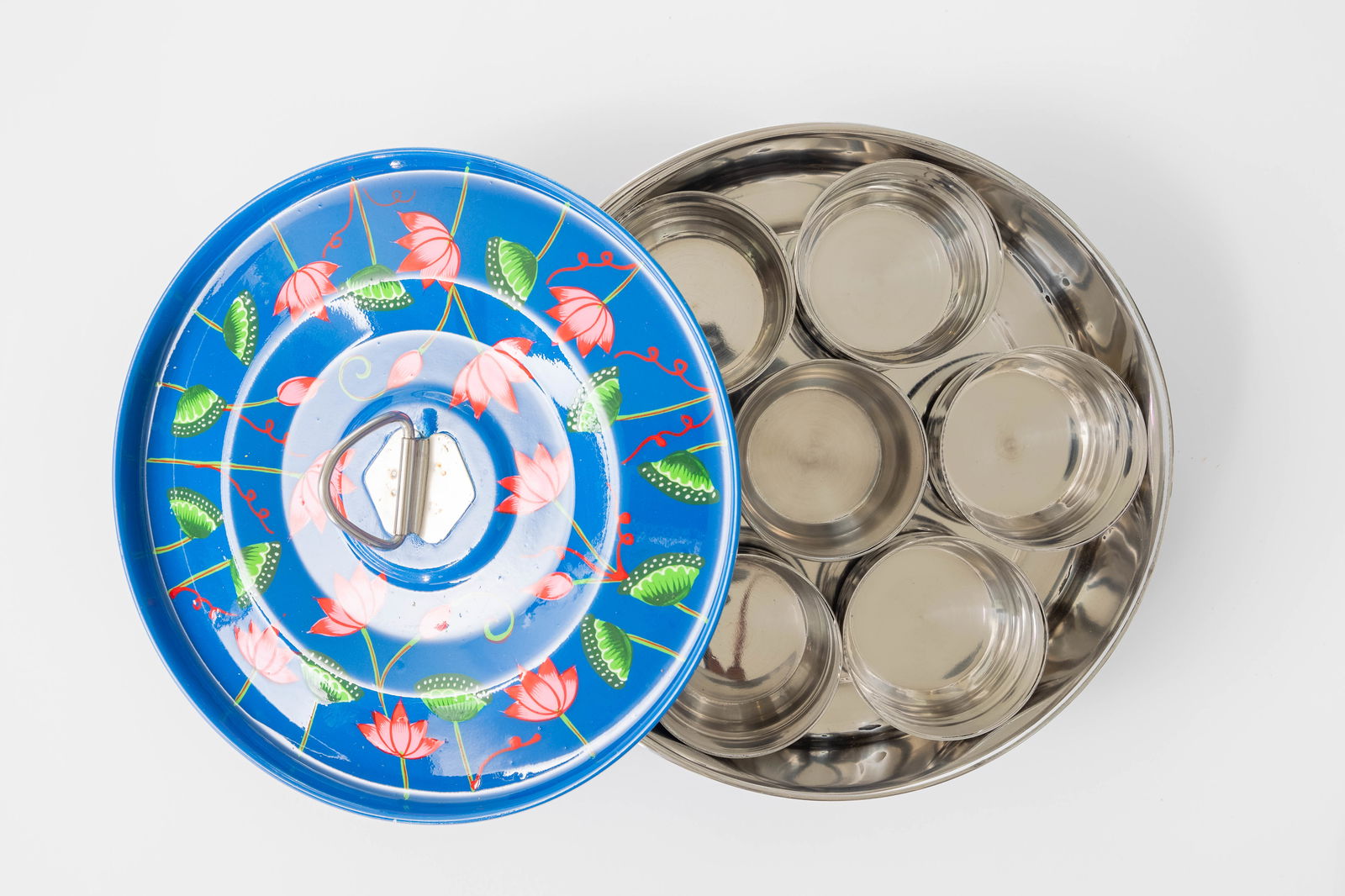 Blue pichhwai enamel masala dabba with lotus design. Empty.