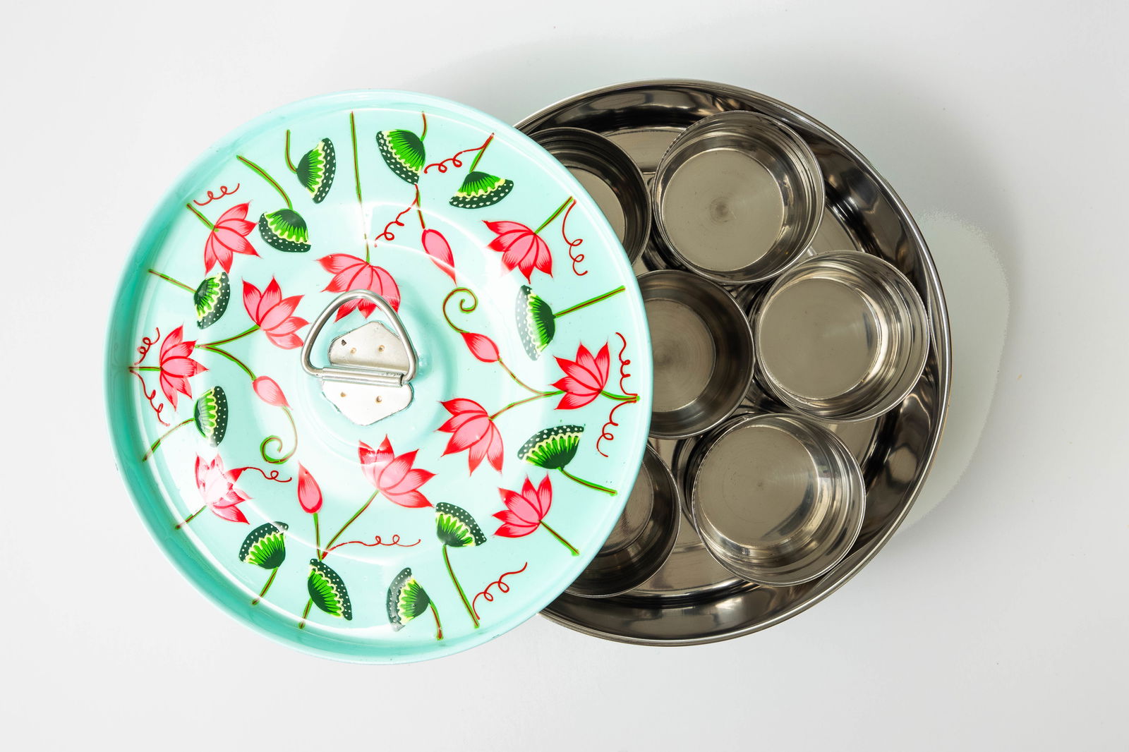 Teal pichhwai enamel masala dabba with lotus design. Empty.